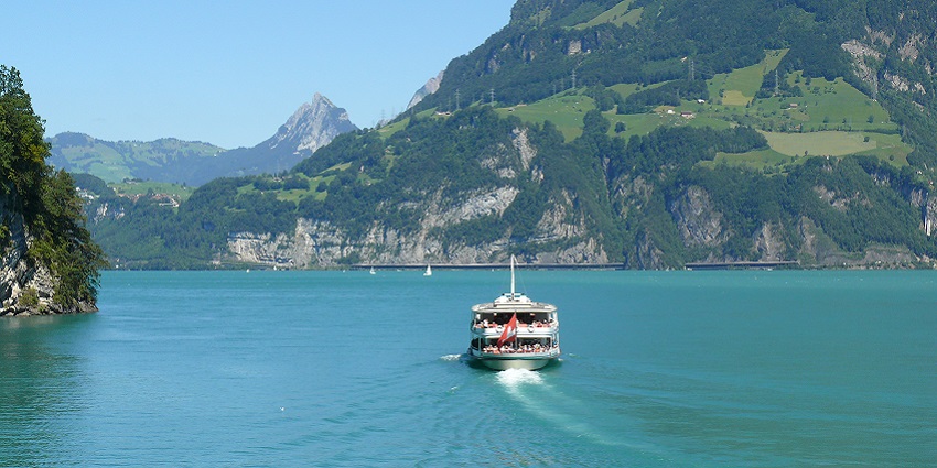 Things to do in Lucerne include a boat ride offering stunning views of mountains and lake.