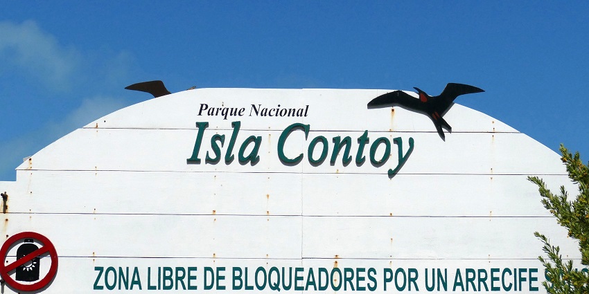 A board at Isla Contoy National Park restricts the use of sun blockers to protect the area's ecology.