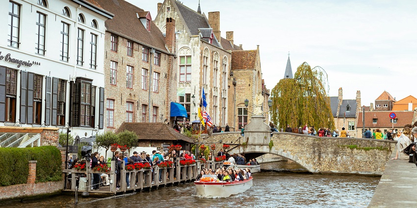 A scenic boat tour through Bruges’ picturesque canals and bridges for a great experience.
