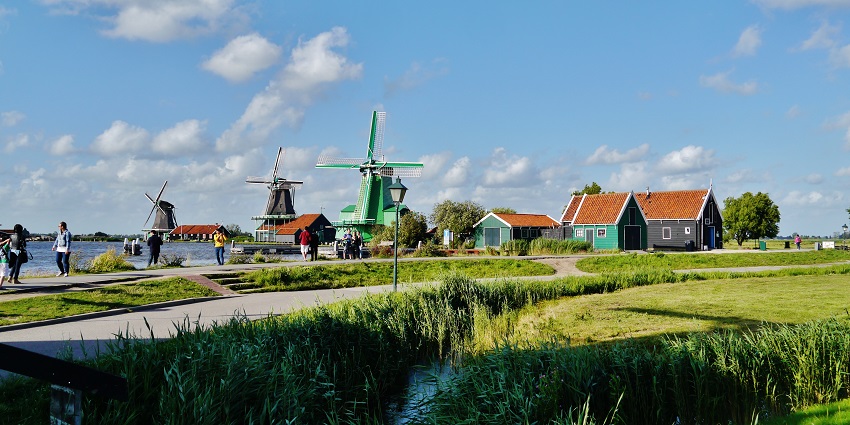 Traditional Dutch village with windmills, crafts, and historical charm.