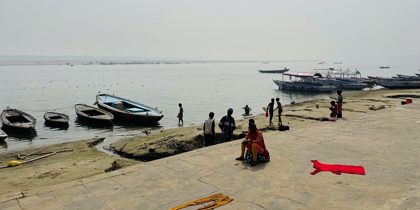 An image of pilgrims taking a holy dip in the Adi Ganga near Kalighat Temple.