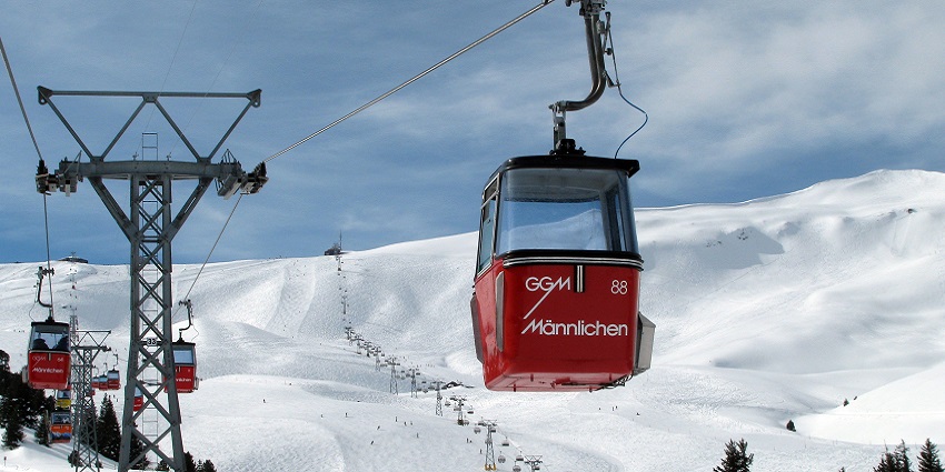 Enjoy panoramic mountain views on a cable car ride in the snowy ambience.