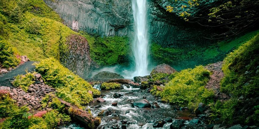 An image of Tanda Falls with luscious trees, one of the best places to visit in Vindhyanchal