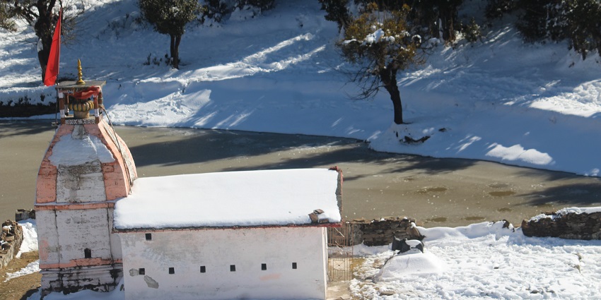 Sacred water body with serene surroundings and religious significance
