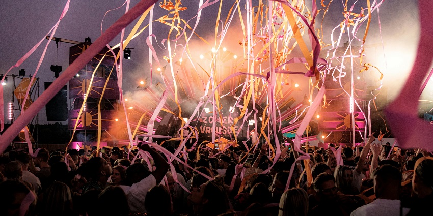 Vibrant techno music parade through Paris celebrating electronic music culture.