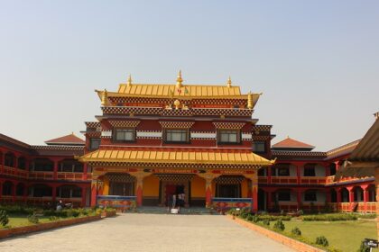 large temple in Canada with intricate architectural details surrounded by trees.