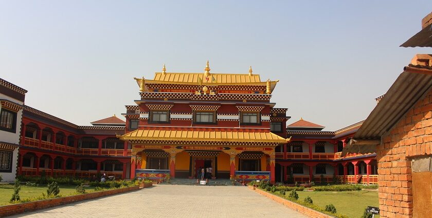 large temple in Canada with intricate architectural details surrounded by trees.