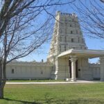 An image of a temple in Texas centre with tall buildings, and wide streets in Plano, Texas