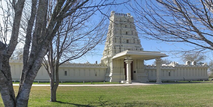 An image of a temple in Texas centre with tall buildings, and wide streets in Plano, Texas