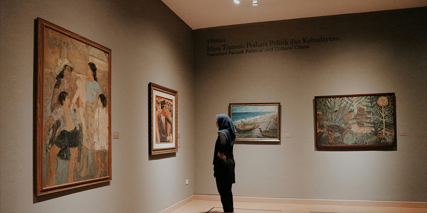 A girl glancing at the Campbell collections which relates to inhabitants of early Natal civilizations.