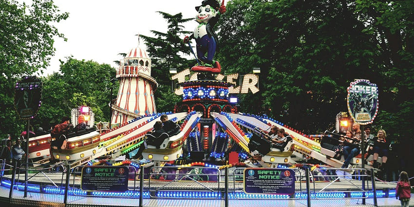 A stunning view of a carnival ride with colourful lights, the best adventure park in NYC.