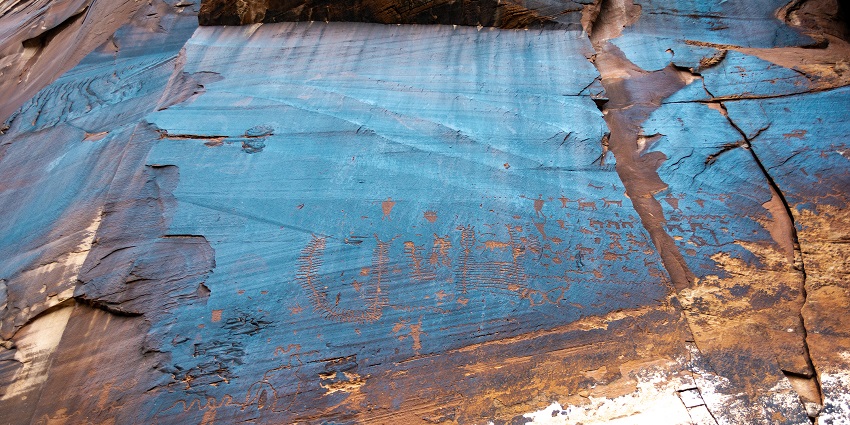 A hiker stands in a rugged canyon, one of the best destinations.