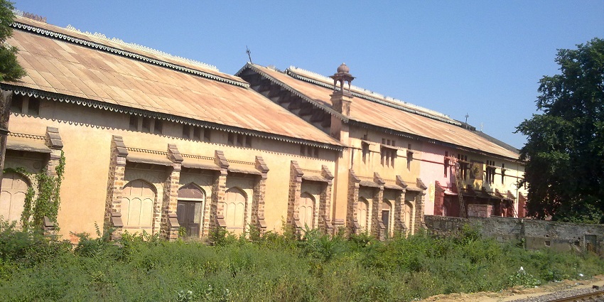 An image of the eerie, abandoned Old Cinema Hall with broken windows and a faded facade.