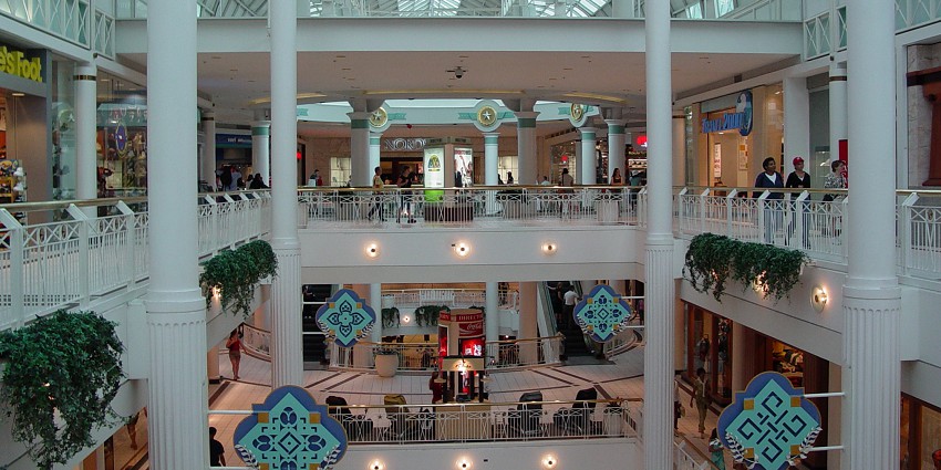 Modern shopping mall with retail stores, dining, and entertainment.