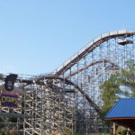 A picture of a roller coaster track at a theme park in NYC