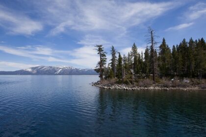 View of the South Shore of Lake Tahoe with a mountain in the background in California, USA.