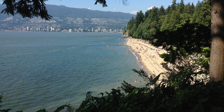 Surrounded by lush greenery, Third Beach - one of the beaches in Vancouver, BC.