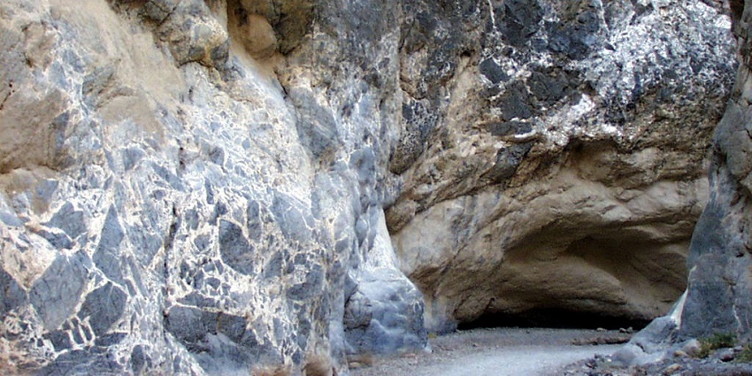 A narrow view of a cave, a popular tourist attraction near Goldwell Open Air Museum