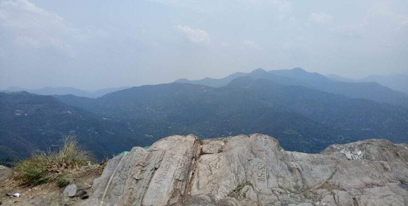 Trekking in Mukteshwar amidst lush forests and breathtaking mountain views.