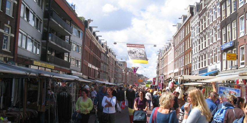 Vibrant market with authentic Dutch foods, crafts, and fresh produce.
