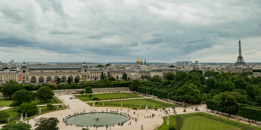 Elegant Parisian garden with fountains, sculptures, and scenic walking paths.