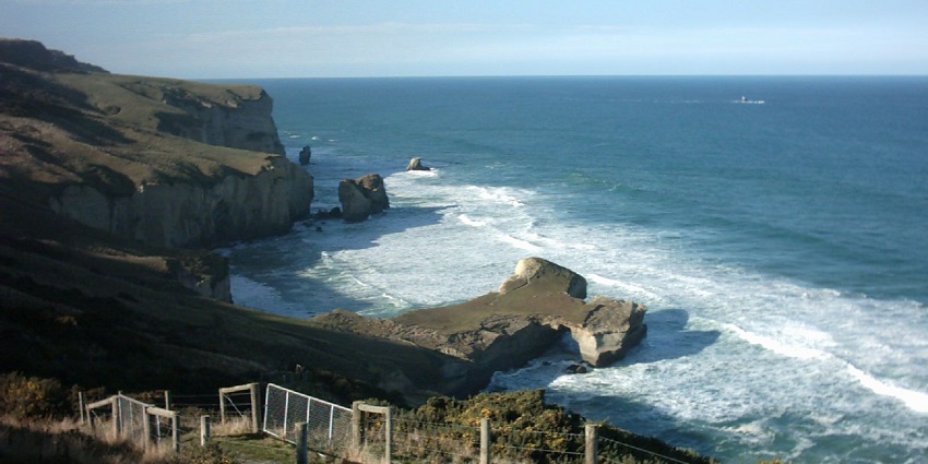 Explore tunnel beach, among places to visit in New Zealand in November.