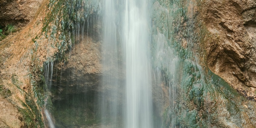 An image of a waterfall, which is identical to the Twin Falls located in north shore of Kauai.