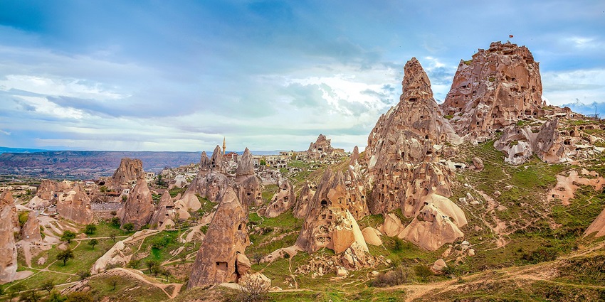 An Ancient rock-hewn castle offering panoramic views of Cappadocia's landscape.