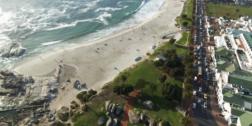 Unwind at the scenic Camps Bay Beach, one of Cape Town’s most beautiful beaches.