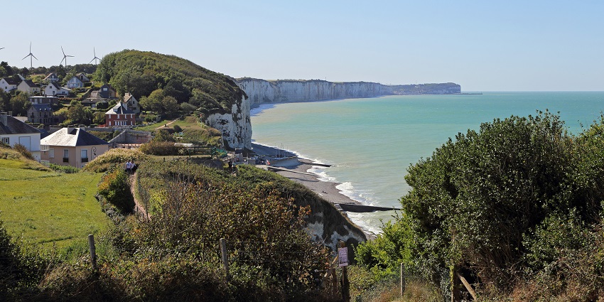 Quaint village with flower-lined streets and charming seaside views