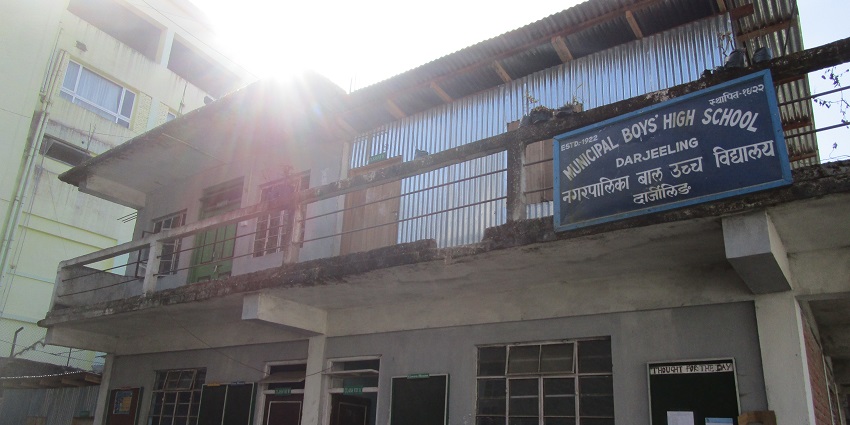 An image of Victoria Boys’ School that has a cross on the top and contains arches as windows.