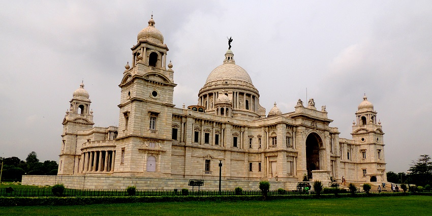 A view of Victoria Memorial illuminated at night, resembling a grand art gallery in Kolkata