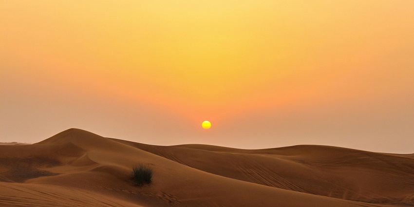Things to do in Saudi Arabia include visiting the vast desert with rolling dunes and scenic magnificence.