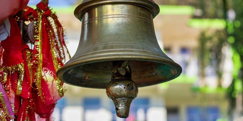 An image of a temple bell in Hanuman Temple near the majestic Anjaneri Hill.