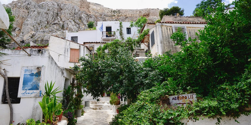 The hidden island Anafiotika in Athens with small houses, green plants and trees
