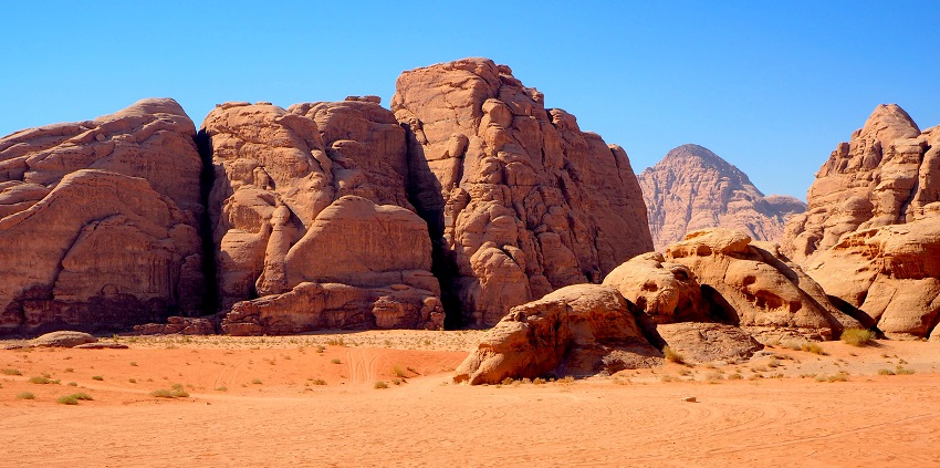 Places to visit in Jordan include stunning sandstone mountains and Bedouin culture.