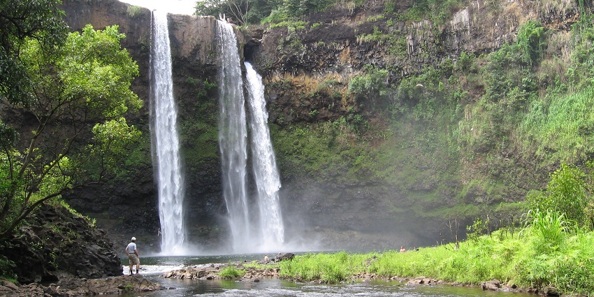 An image of Wailua Falls, a famous tourist destination to visit near Kauai Hindu Monastery.