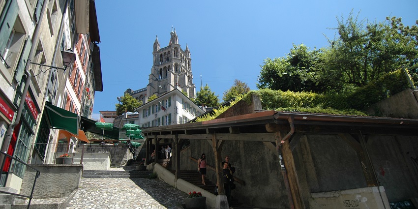 Historic wooden staircase connecting markets and Lausanne Old Town.