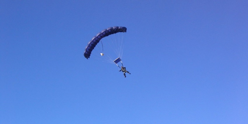 An individual captured skydiving above Lake Wanaka in New Zealand