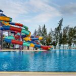 An image of a water park in Agra with colourful water slides, and a swimming pool