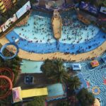 An image of the top-viewed water park where people are enjoying rides and pools.