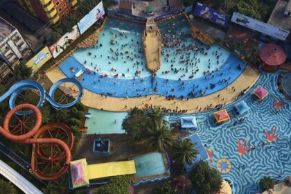 An image of the top-viewed water park where people are enjoying rides and pools.