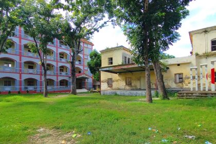 An image of a serene building in Durgapur with green landscape in the backdrop.