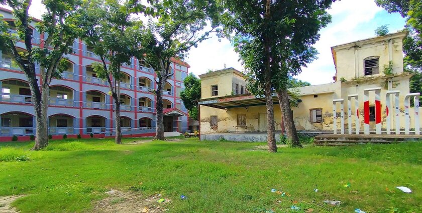 An image of a serene building in Durgapur with green landscape in the backdrop.