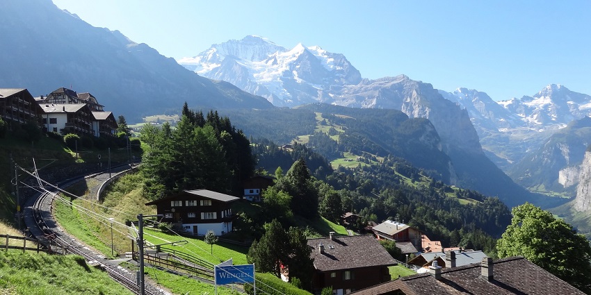 Idyllic alpine village accessible by train, offering stunning mountain views.