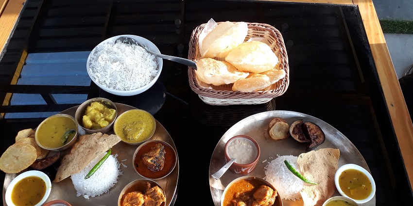 A representative image of authentic Bengali cuisine served at Oh! Calcutta near Gurusaday Museum.