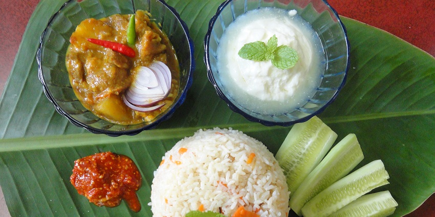 A traditional Bengali meal near Bakreshwar Hot Spring: pulao, mangsha, and misti doi.