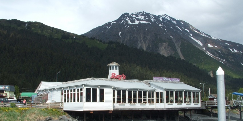An image of Ray's Waterfront offers stunning views of the harbour, with fresh seafood and charm