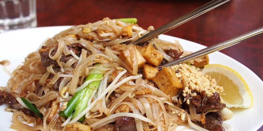 A bowl of pad thai noodles - You can enjoy a variety of snacks around