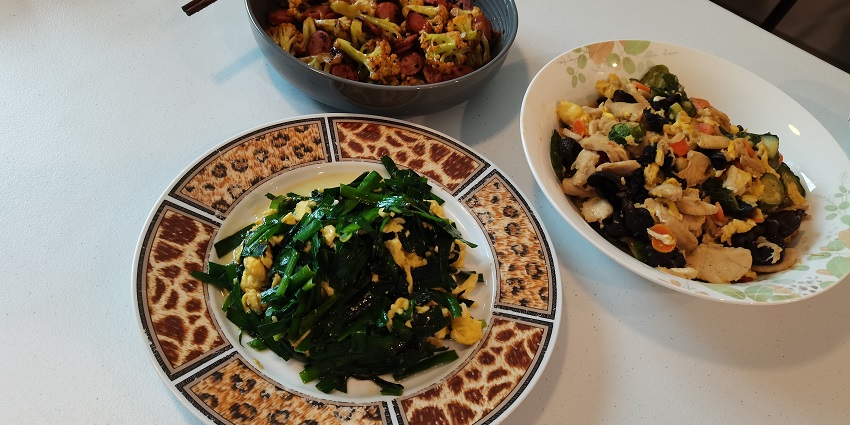 Image of home cooked food with lots of healthy green vegetable served on a table